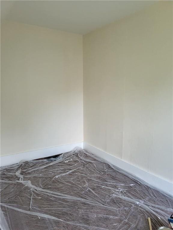 unfurnished bedroom featuring baseboards