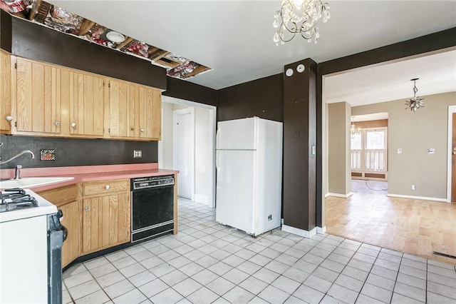 kitchen featuring a sink, white appliances, a notable chandelier, and light brown cabinets