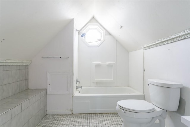 bathroom with tile patterned floors, bathtub / shower combination, toilet, and lofted ceiling