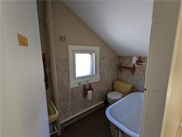 full bath with baseboard heating, toilet, and vaulted ceiling