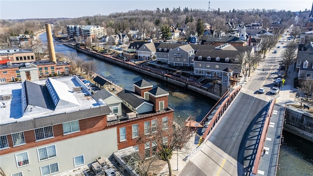 drone / aerial view featuring a residential view and a water view