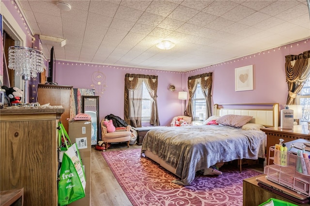 bedroom with wood finished floors