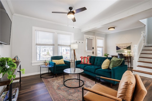 living area featuring crown molding, baseboards, stairway, wood finished floors, and a ceiling fan