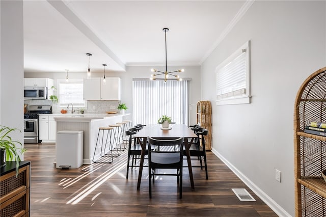 dining area featuring dark wood finished floors, visible vents, baseboards, and ornamental molding