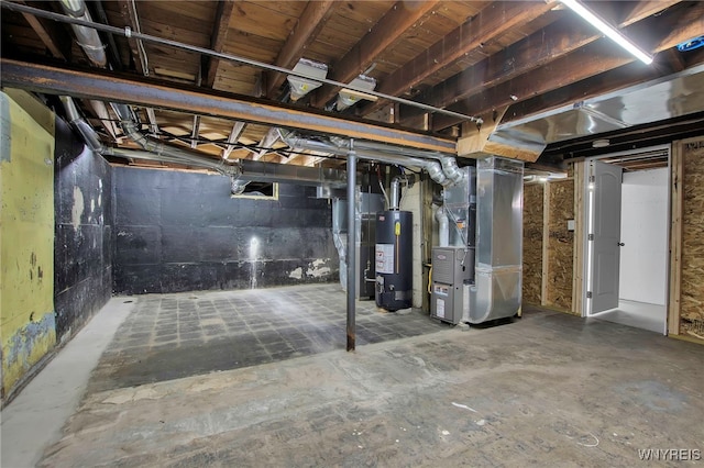 unfinished basement featuring heating unit and water heater