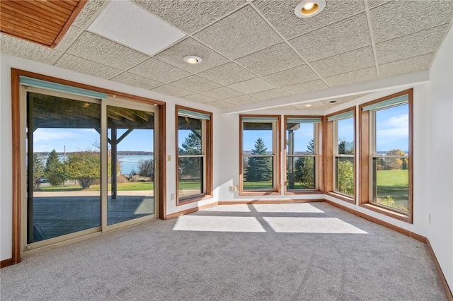 interior space featuring a healthy amount of sunlight and a paneled ceiling