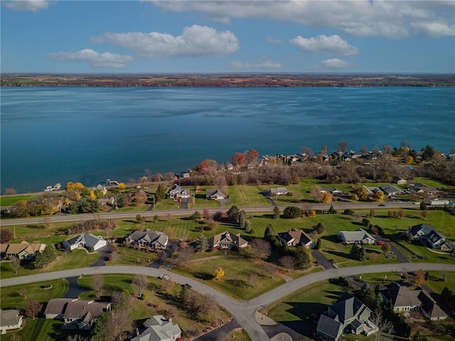 birds eye view of property featuring a water view and a residential view