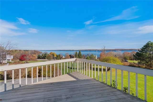 deck featuring a yard and a water view