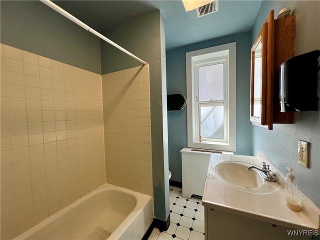 full bath with tile patterned floors, visible vents, toilet, tub / shower combination, and vanity