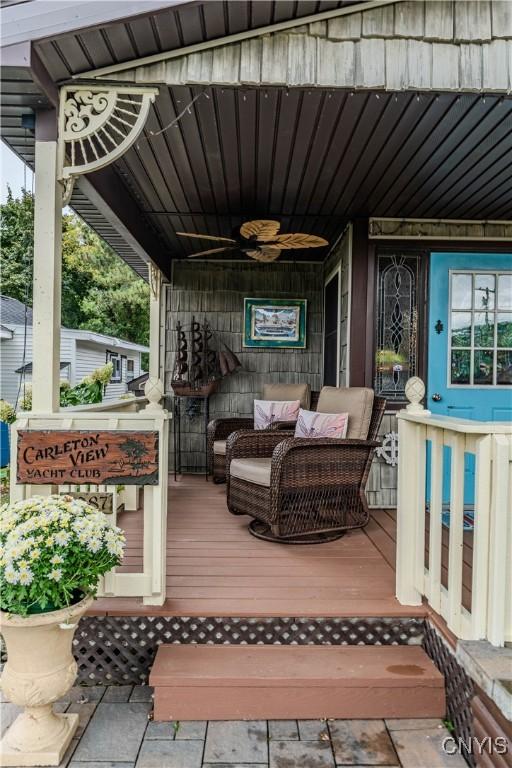 exterior space with an outdoor living space and ceiling fan