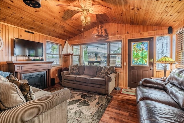 living room with wood walls, wooden ceiling, wood finished floors, and vaulted ceiling