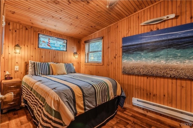 bedroom with wood finished floors, wooden ceiling, wood walls, baseboard heating, and vaulted ceiling