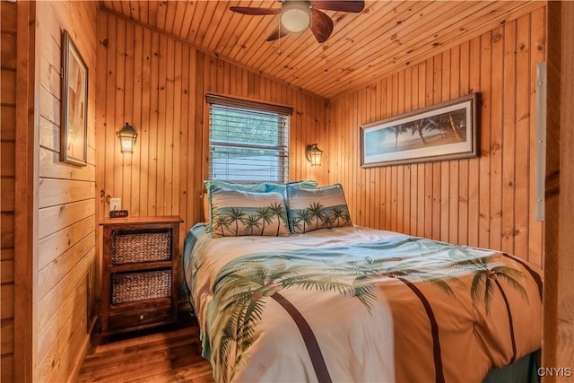 bedroom with wood finished floors, wooden walls, lofted ceiling, and wooden ceiling