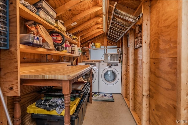 clothes washing area with washing machine and dryer and laundry area