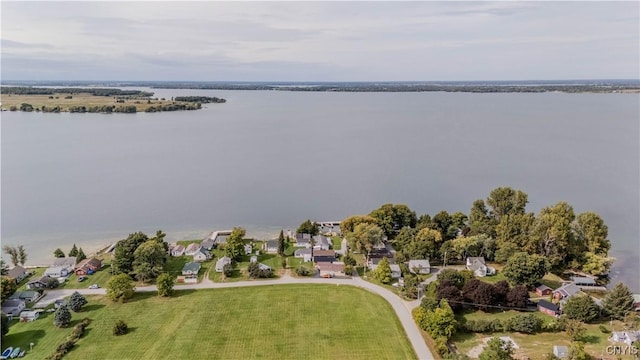 birds eye view of property with a residential view and a water view