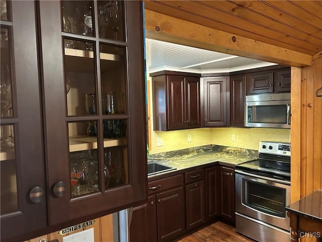 6087 Carlton View Assoc Dr, Cape Vincent, NY 13618 - kitchen featuring dark countertops, dark brown cabinets, appliances with stainless steel finishes, dark wood-type flooring, and wood ceiling
