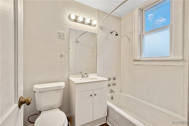 bathroom featuring toilet, washtub / shower combination, and vanity