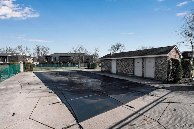 view of pool with fence