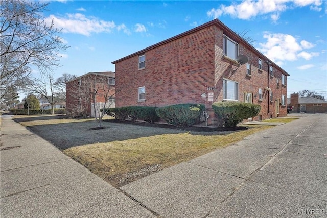 view of home's exterior featuring brick siding