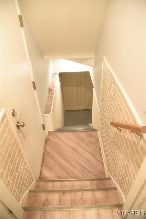 stairway with wood finished floors