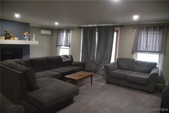 carpeted living room featuring a fireplace, an AC wall unit, crown molding, and a wealth of natural light