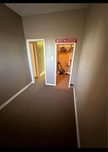 hallway featuring baseboards