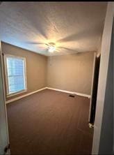 unfurnished bedroom featuring baseboards, carpet, and ceiling fan