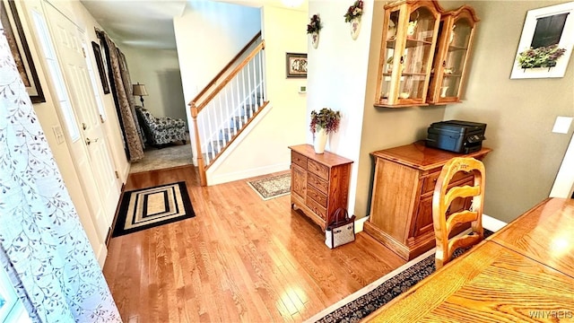 interior space featuring baseboards and wood finished floors