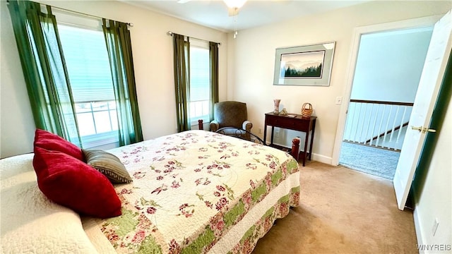 carpeted bedroom featuring baseboards