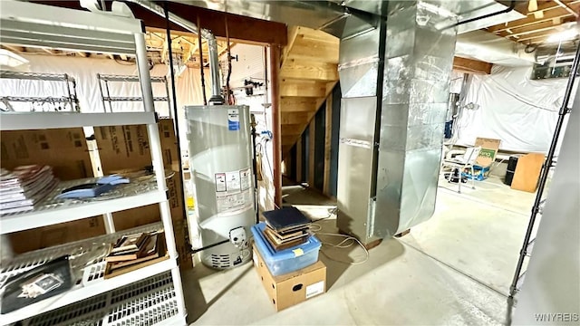 utility room featuring heating unit and water heater