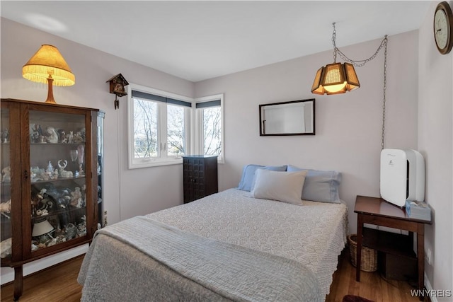 bedroom with wood finished floors