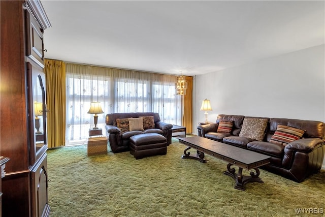 living room with a notable chandelier and carpet floors