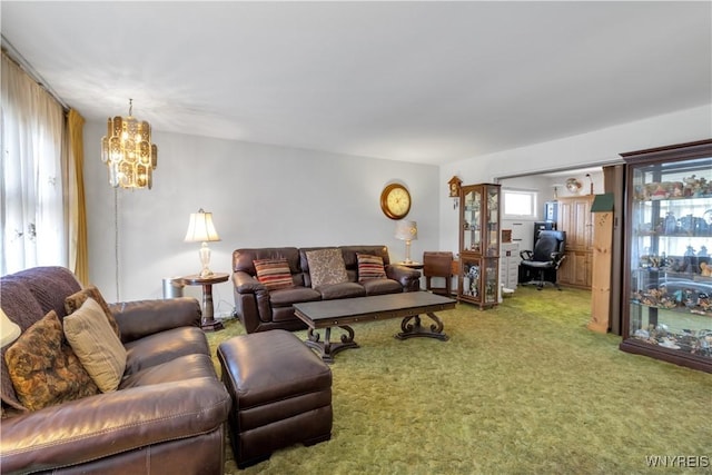 carpeted living room with a chandelier