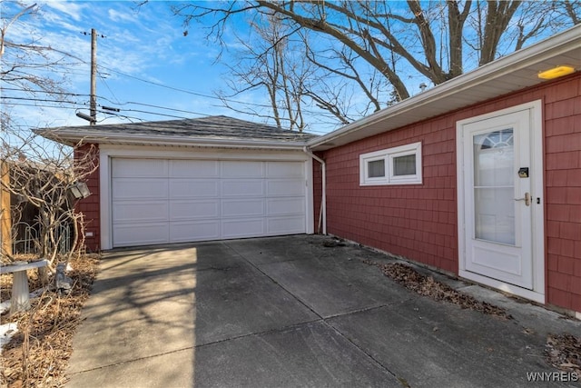 garage featuring driveway