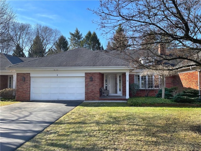 ranch-style home featuring brick siding, a front lawn, aphalt driveway, roof with shingles, and an attached garage