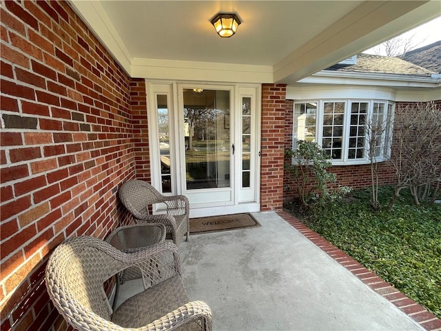 entrance to property with brick siding