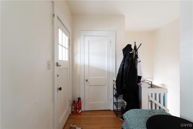 doorway to outside with wood finished floors