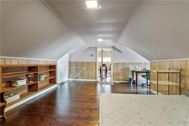 bonus room with wood finished floors, a wainscoted wall, vaulted ceiling, wood walls, and baseboard heating