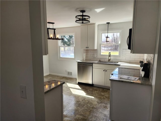 kitchen featuring a sink, backsplash, white cabinetry, black microwave, and dishwasher