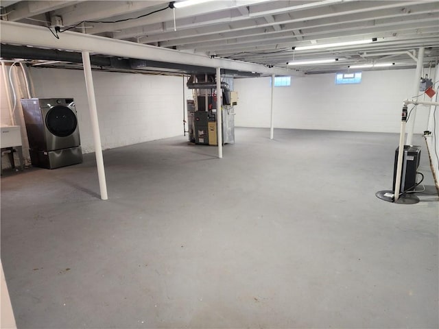 below grade area with heating unit and washer / dryer