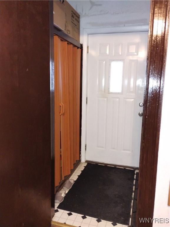 doorway featuring light floors