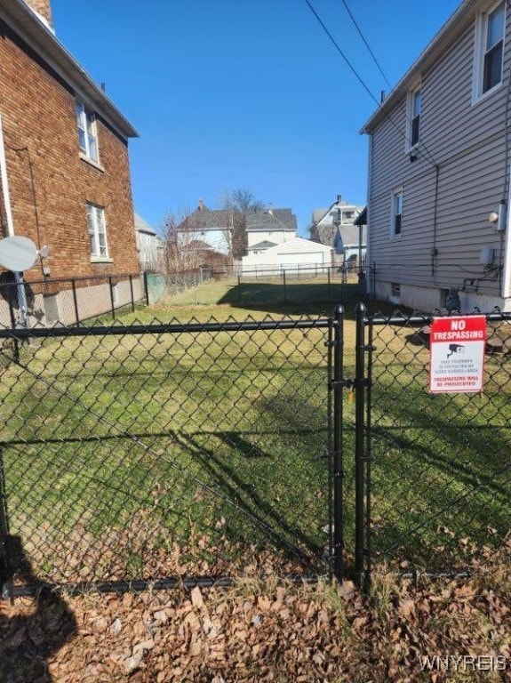 view of yard featuring a gate and fence