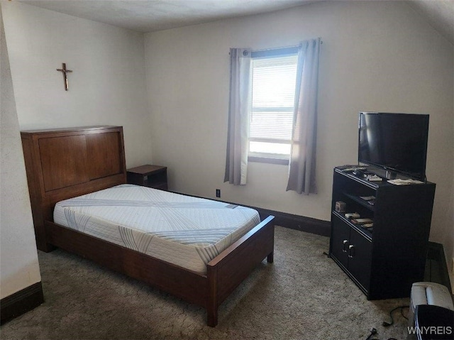 bedroom with baseboards and carpet flooring