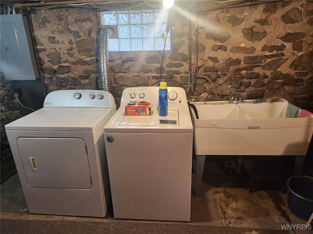 washroom featuring a sink, independent washer and dryer, laundry area, and electric panel