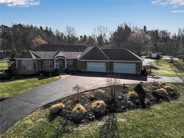 ranch-style house with a front lawn, concrete driveway, and a garage