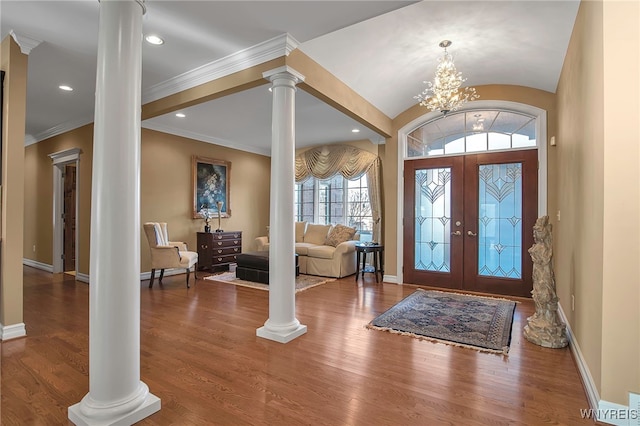 foyer featuring recessed lighting, baseboards, ornate columns, and wood finished floors