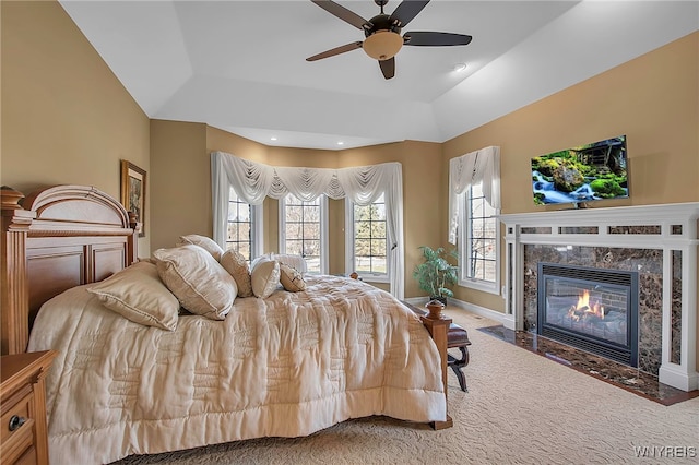 bedroom with carpet, baseboards, recessed lighting, a fireplace, and ceiling fan