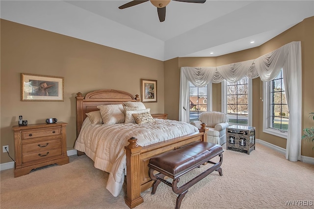 bedroom with recessed lighting, light colored carpet, baseboards, and ceiling fan