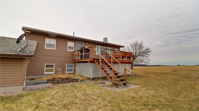 rear view of property featuring stairs, a yard, a deck, and a chimney