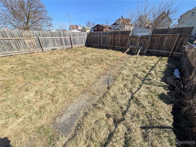 view of yard with a fenced backyard